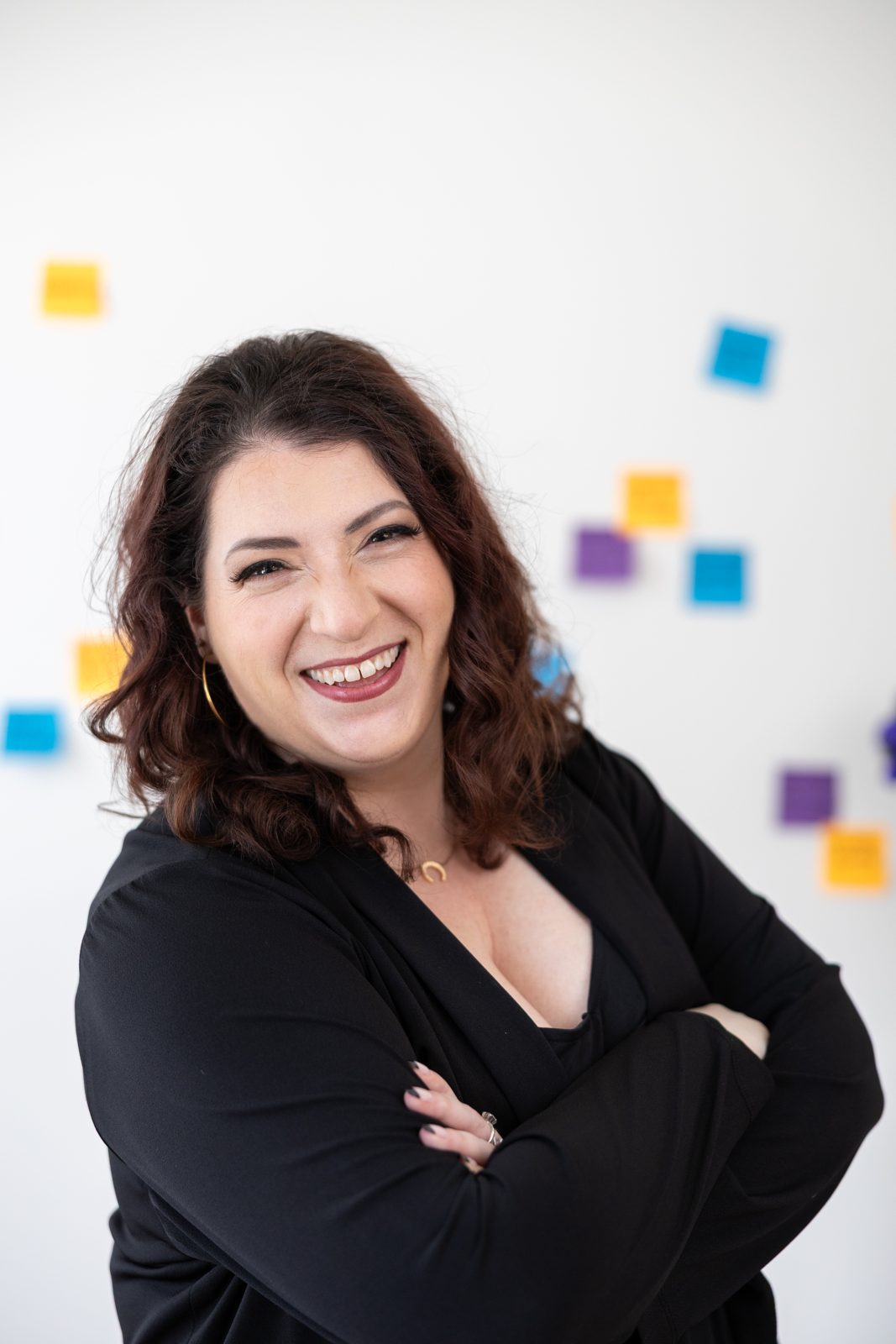 Lindsay Mastro laughing with arms crossed